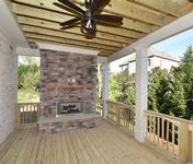 Covered Porch w Fireplace in home built by Atlanta Home Builder Waterford Homes